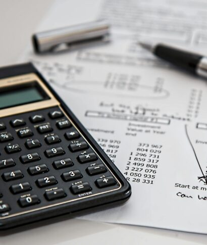 calculator-calculation-insurance-finance-53621-53621 Close-up of financial documents with calculator and pen, ideal for business management themes.